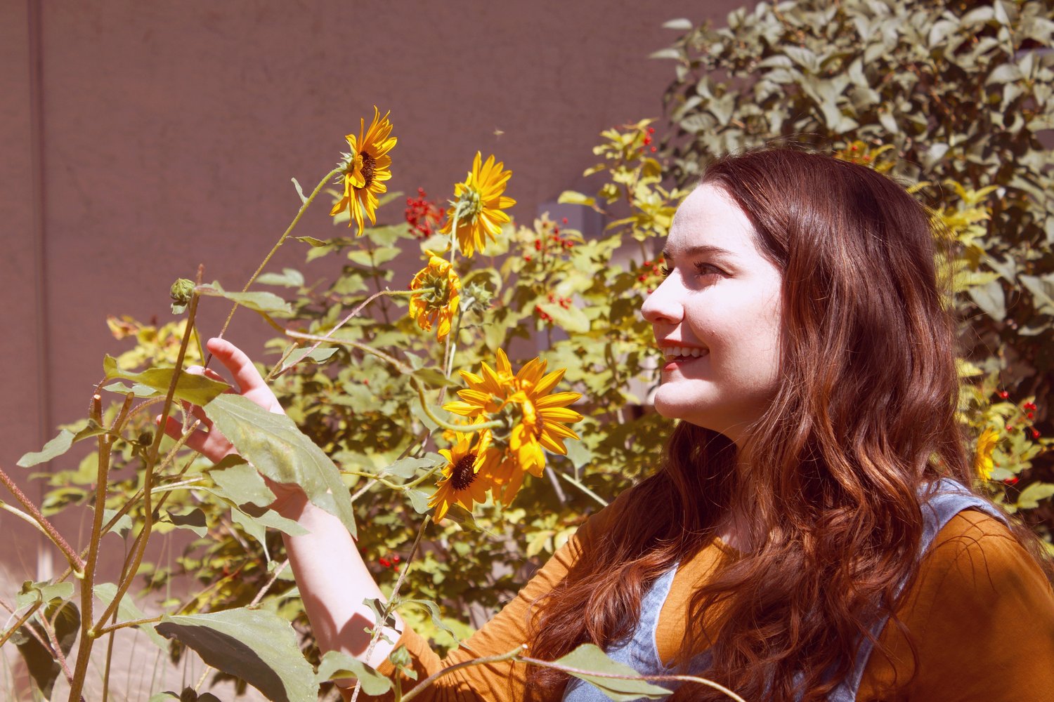 about shine daily featured image of blair touching sunflowers